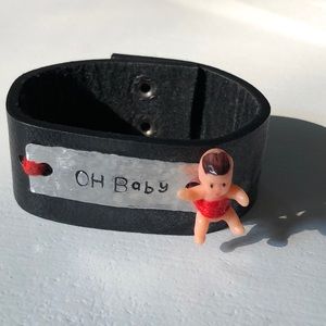 Genuine leather cuff bracelet, hand stamped silver “Oh Baby”& plastic baby doll